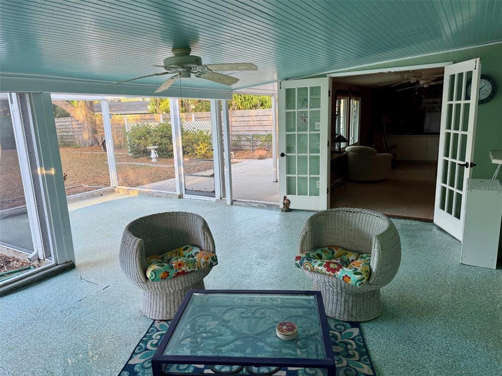 2233 Alice Road Sarasota, FL 34231 - Photo 24 of 30 a living room with furniture and a floor to ceiling window