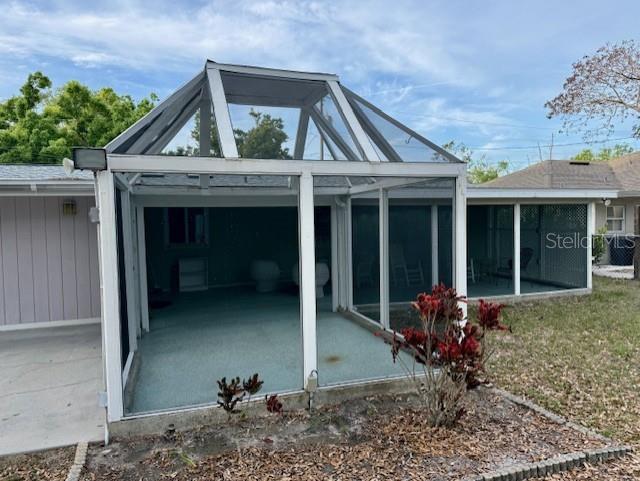 2233 Alice Road Sarasota, FL 34231 - Photo 27 of 30 a view of a house with a yard and sitting space