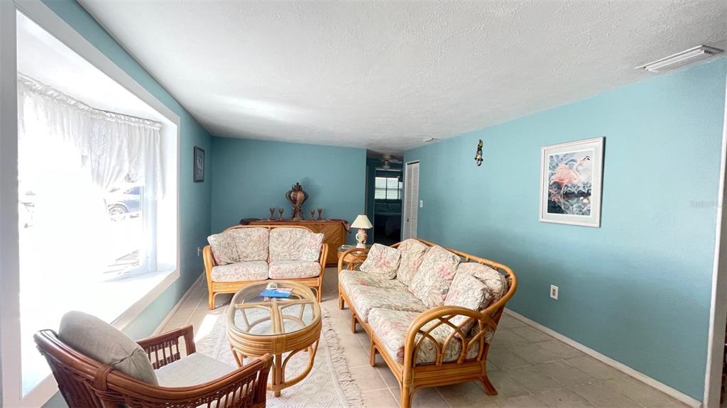 2233 Alice Road Sarasota, FL 34231 - Photo 3 of 30 a living room with furniture and a table