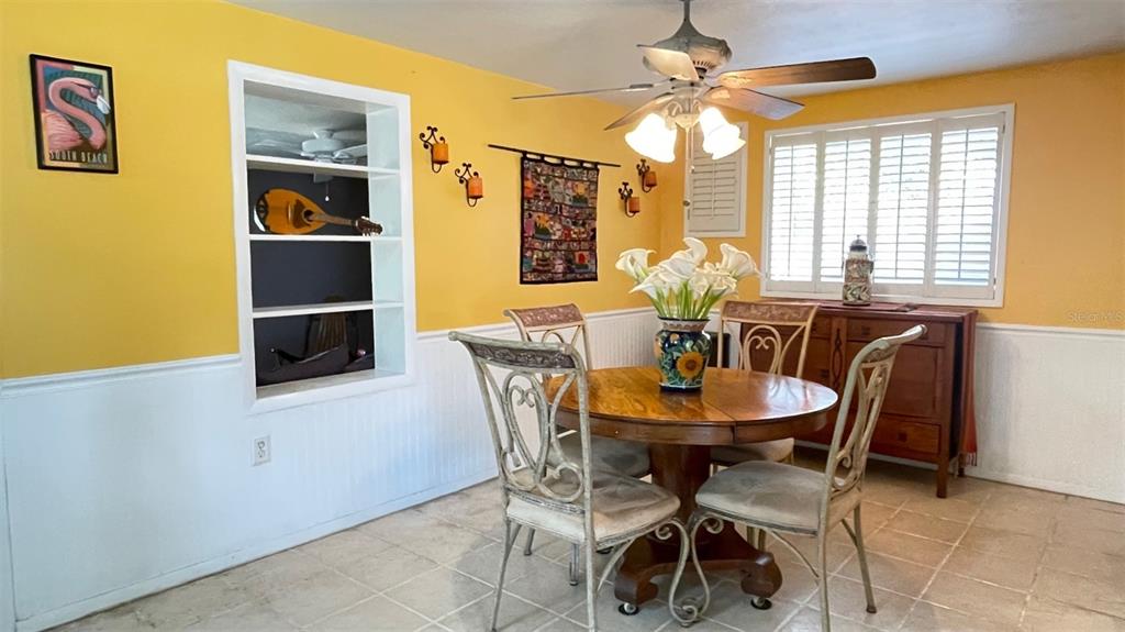 2233 Alice Road Sarasota, FL 34231 - Photo 6 of 30 a dining room with furniture and window