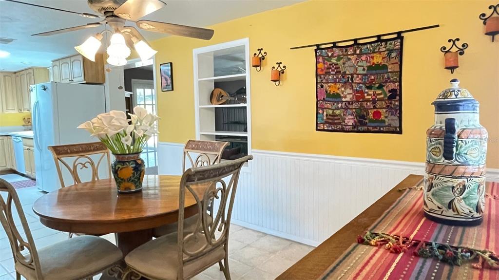 2233 Alice Road Sarasota, FL 34231 - Photo 8 of 30 a view of a dining room with furniture and chandelier