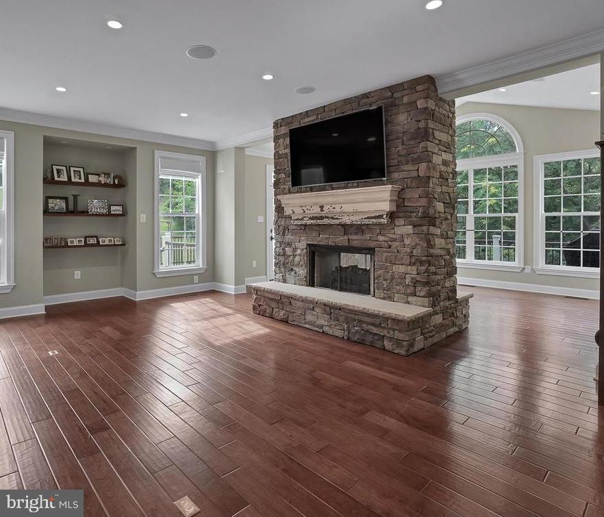 6354 South Clifton Road Frederick, MD 21703 - Photo 19 of 50 Family Room w/ Stone Double Sided Fireplace