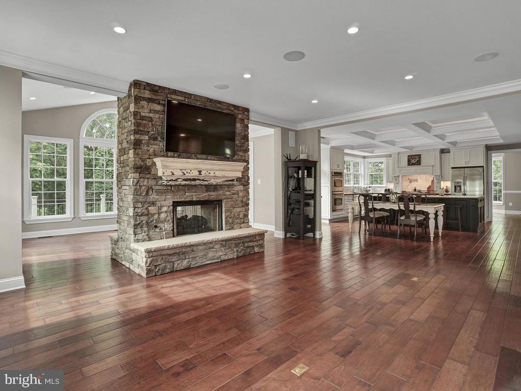 6354 South Clifton Road Frederick, MD 21703 - Photo 20 of 50 Family Room w/ Stone Double Sided FireplaceFamily