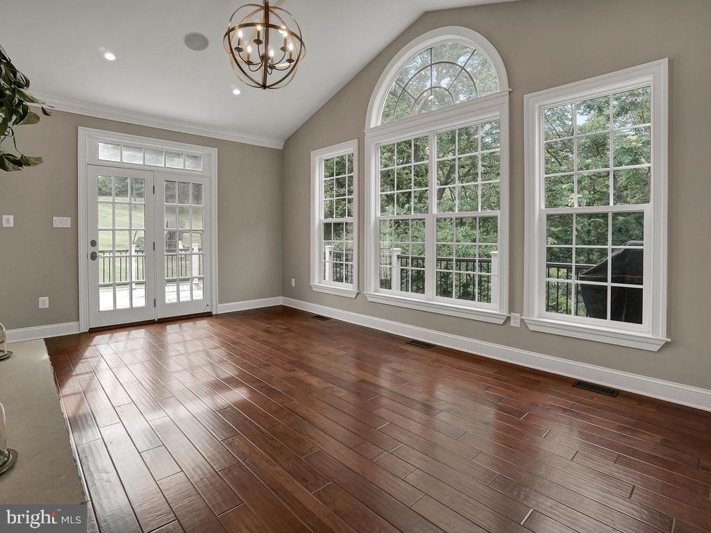 6354 South Clifton Road Frederick, MD 21703 - Photo 21 of 50 Sunroom w/ Stone Double Sided Fireplace