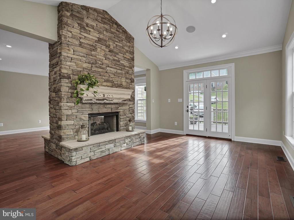 6354 South Clifton Road Frederick, MD 21703 - Photo 22 of 50 Sunroom w/ Stone Double Sided Fireplace