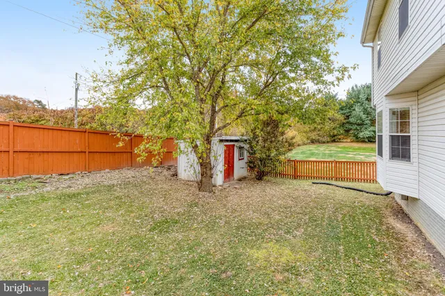 a backyard of a house with shaded area