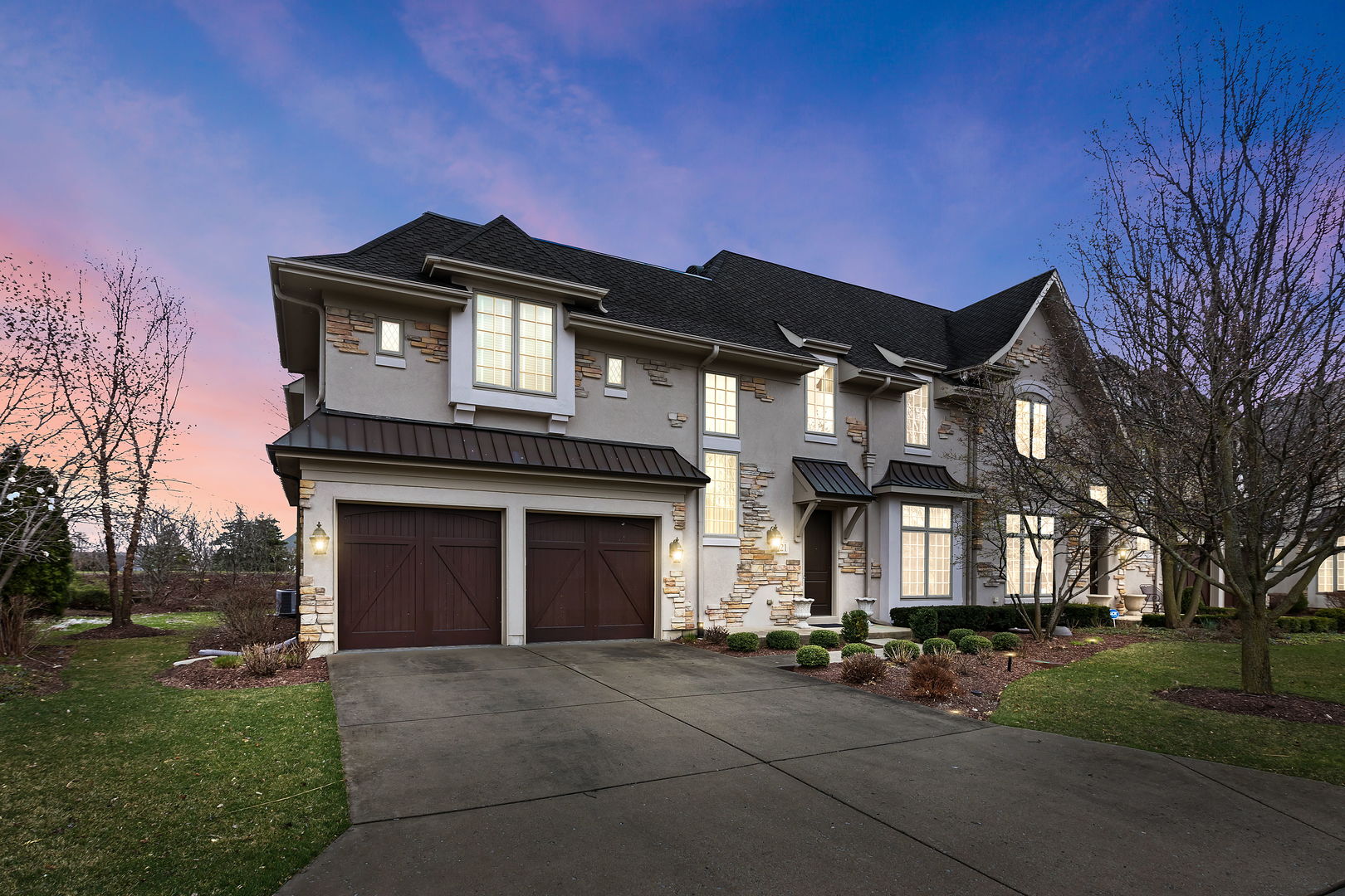 a front view of a house with a yard