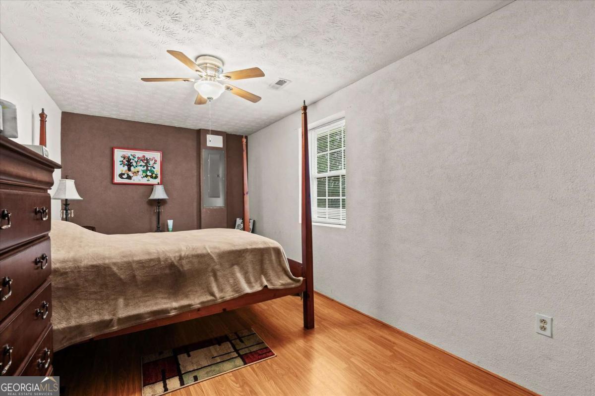 40-l Z L Z Jackson Road Bowdon, GA 30108 - Photo 16 of 32 a bedroom with a bed and a window