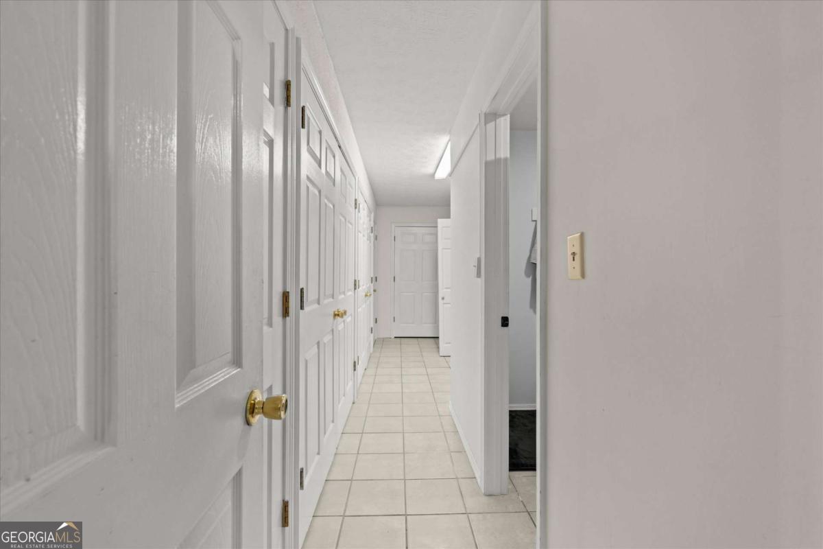 40-l Z L Z Jackson Road Bowdon, GA 30108 - Photo 18 of 32 a view of a hallway with wooden floor