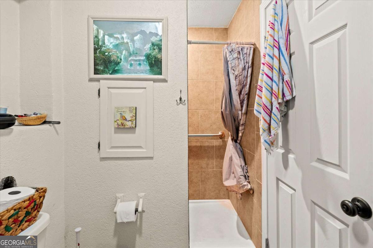 40-l Z L Z Jackson Road Bowdon, GA 30108 - Photo 20 of 32 a view of walk in closet with clothes and shoes