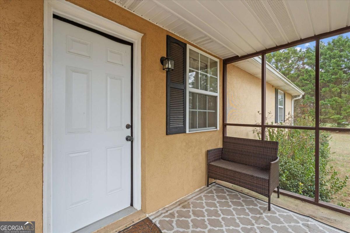 40-l Z L Z Jackson Road Bowdon, GA 30108 - Photo 3 of 32 a view of front door and porch