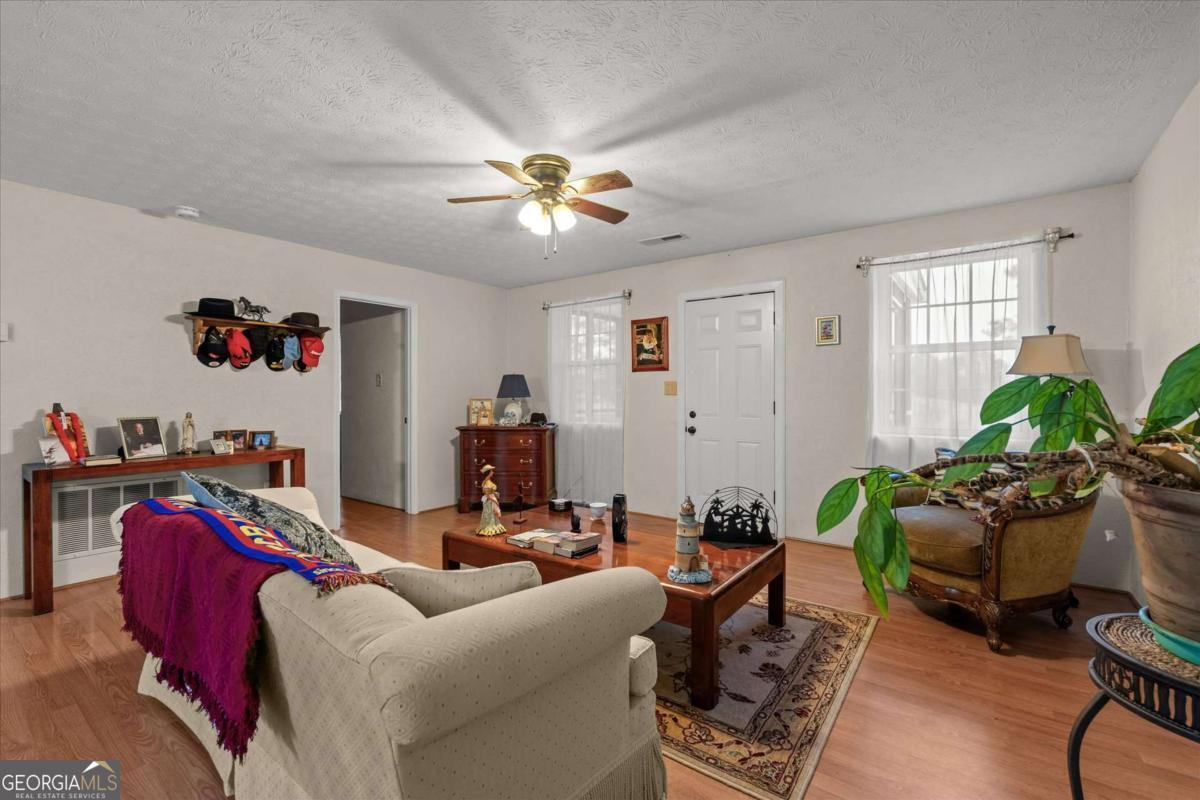 40-l Z L Z Jackson Road Bowdon, GA 30108 - Photo 7 of 32 a living room with furniture flowerpot and a window