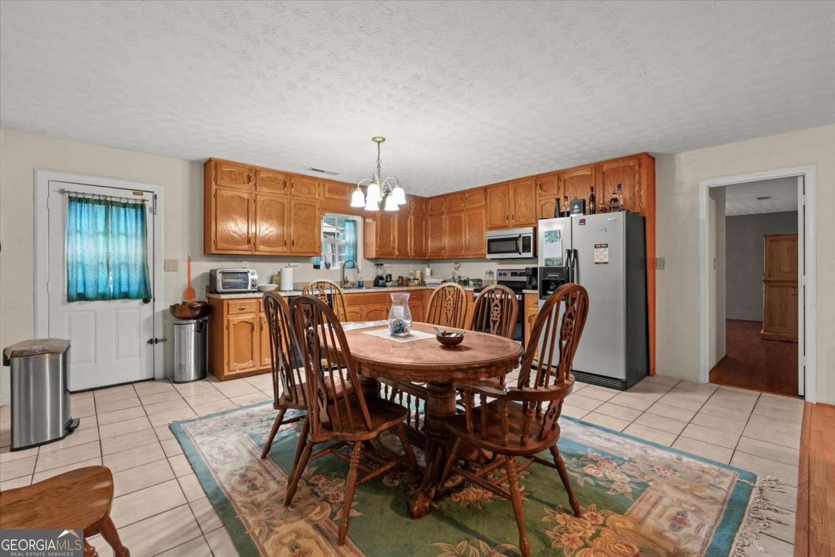 40-l Z L Z Jackson Road Bowdon, GA 30108 - Photo 8 of 32 a view of a dining room with furniture