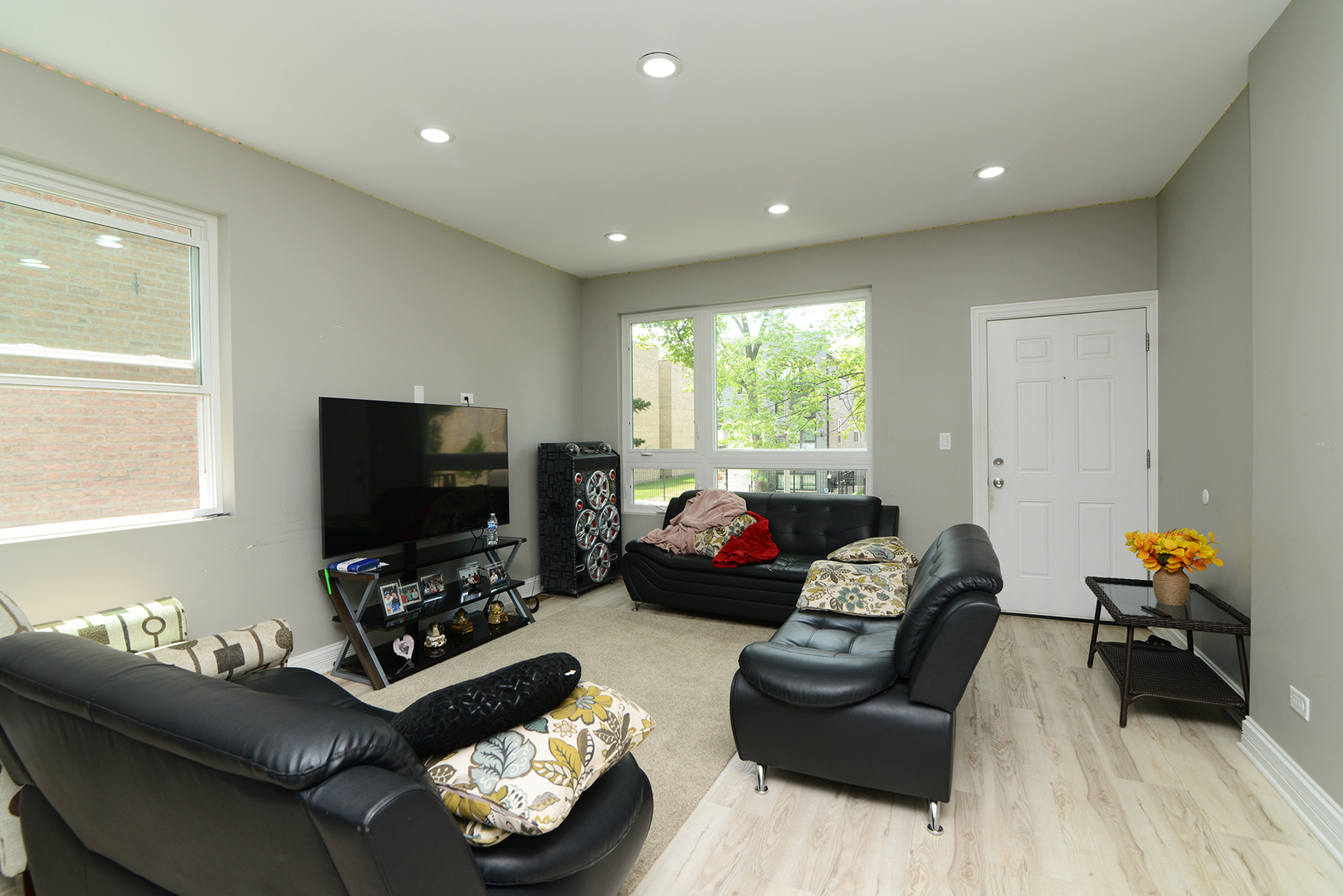 1051 North Springfield Avenue Chicago, IL 60651 - Photo 21 of 50 a living room with furniture and a flat screen tv
