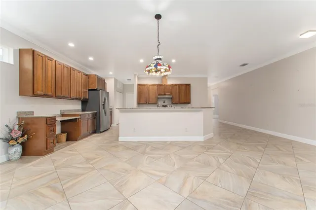 a view of a kitchen with microwave and cabinets