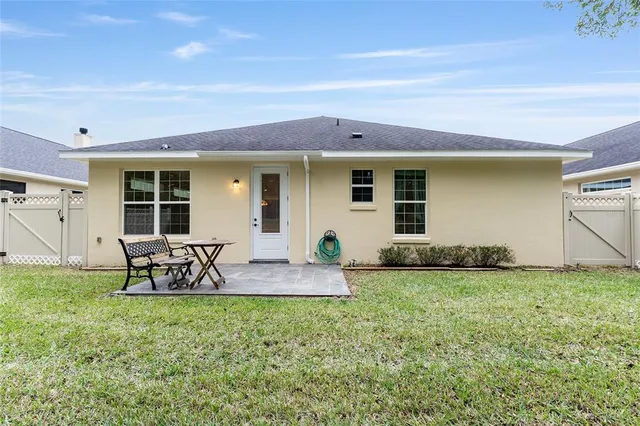 a front view of house with yard and outdoor seating