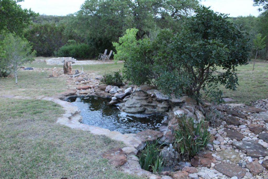 5255 Lookout Ridge Drive Marble Falls, TX 78654 - Photo 35 of 40 Side yard flowing fountain and patio fire pit