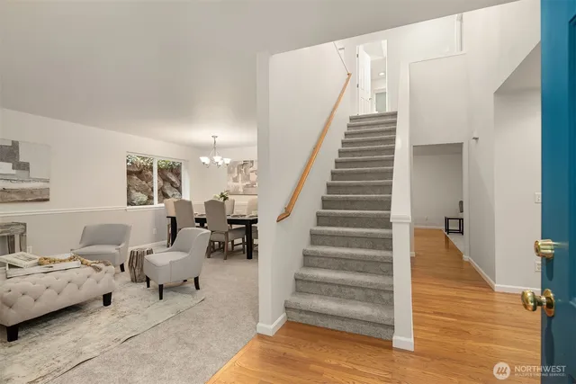 a kitchen with stainless steel appliances a stove sink microwave and cabinets