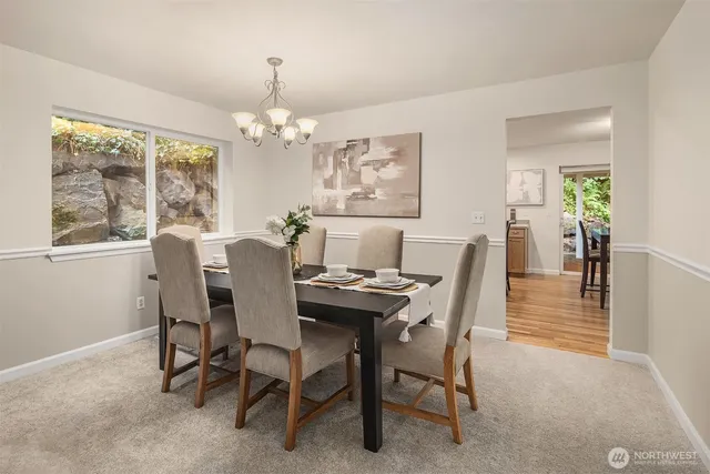 a kitchen with granite countertop a sink stove and refrigerator