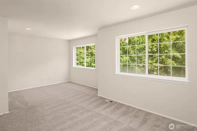 a dining room with furniture a chandelier and a rug