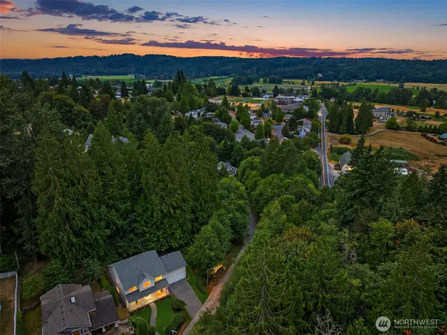 a living room with furniture and stairs