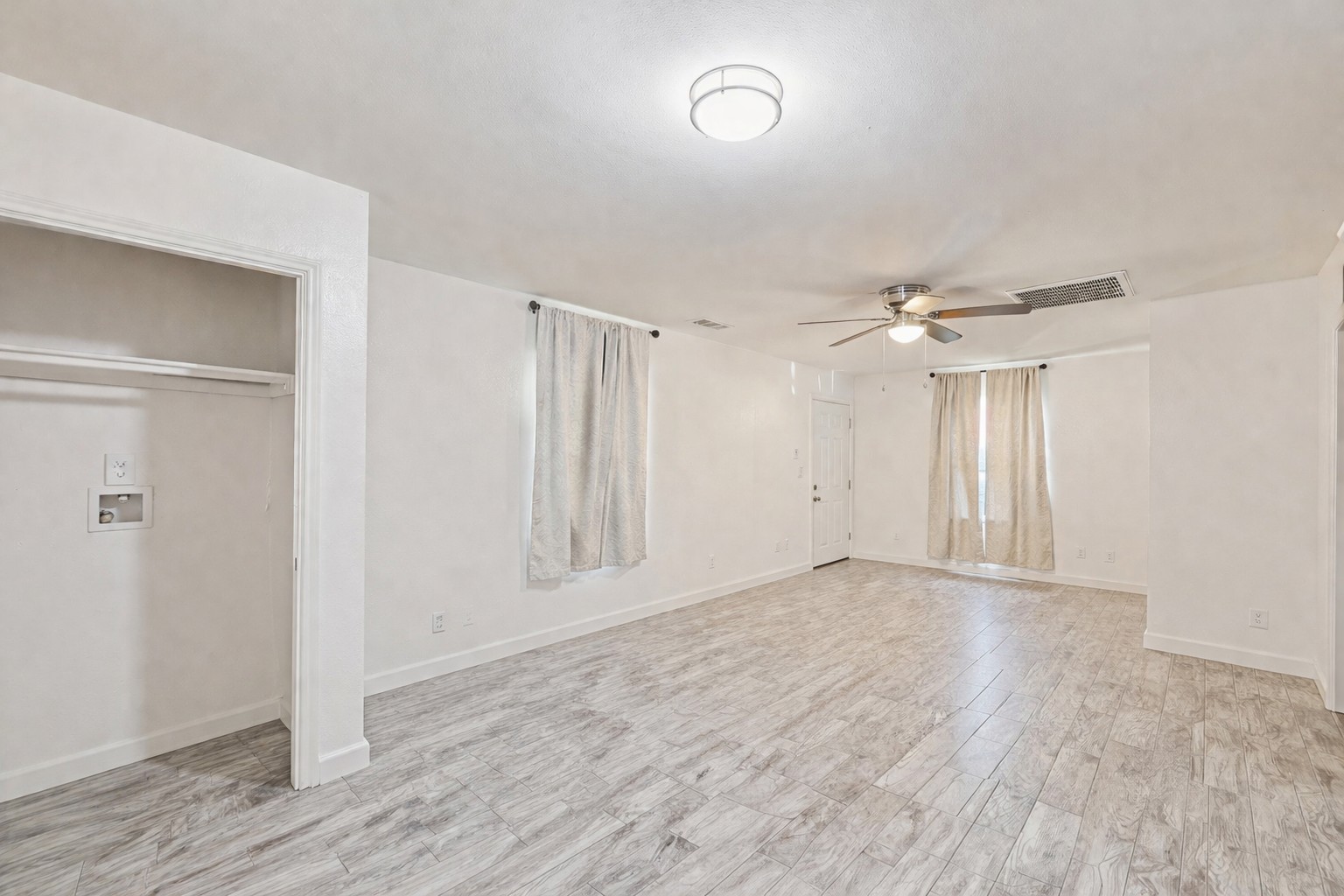 200 Monterrey Street, Unit A & B Elgin, TX 78621 - Photo 5 of 32 Living room with in-unit laundry. 200 Monterrey, Elgin, TX 78621