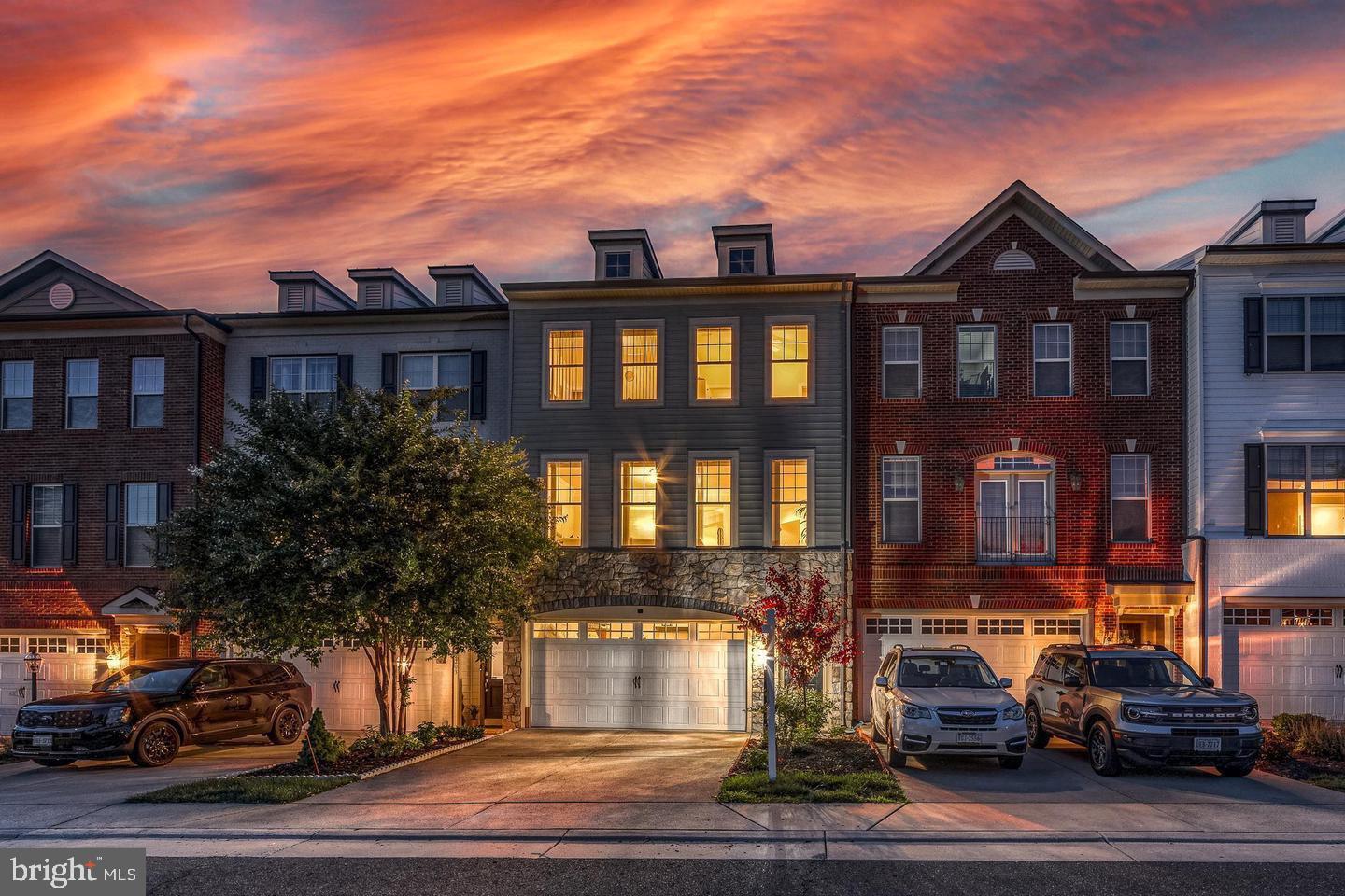 Charming townhomes under a vibrant sunset.