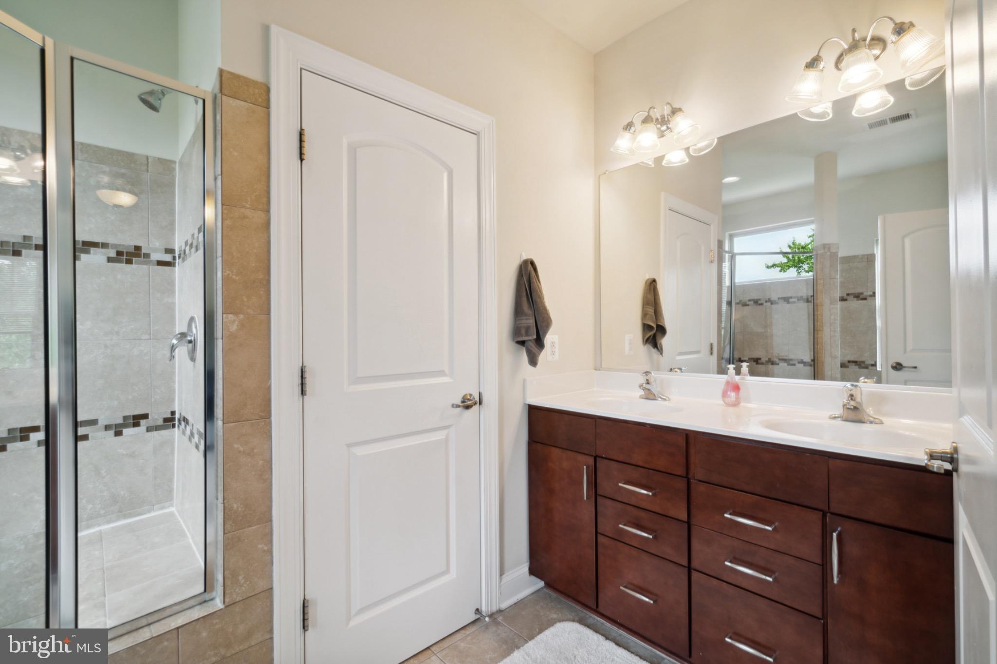 22201 Falling Terrace Ashburn, VA 20148 - Photo 14 of 26 Modern bathroom with elegant finishes.