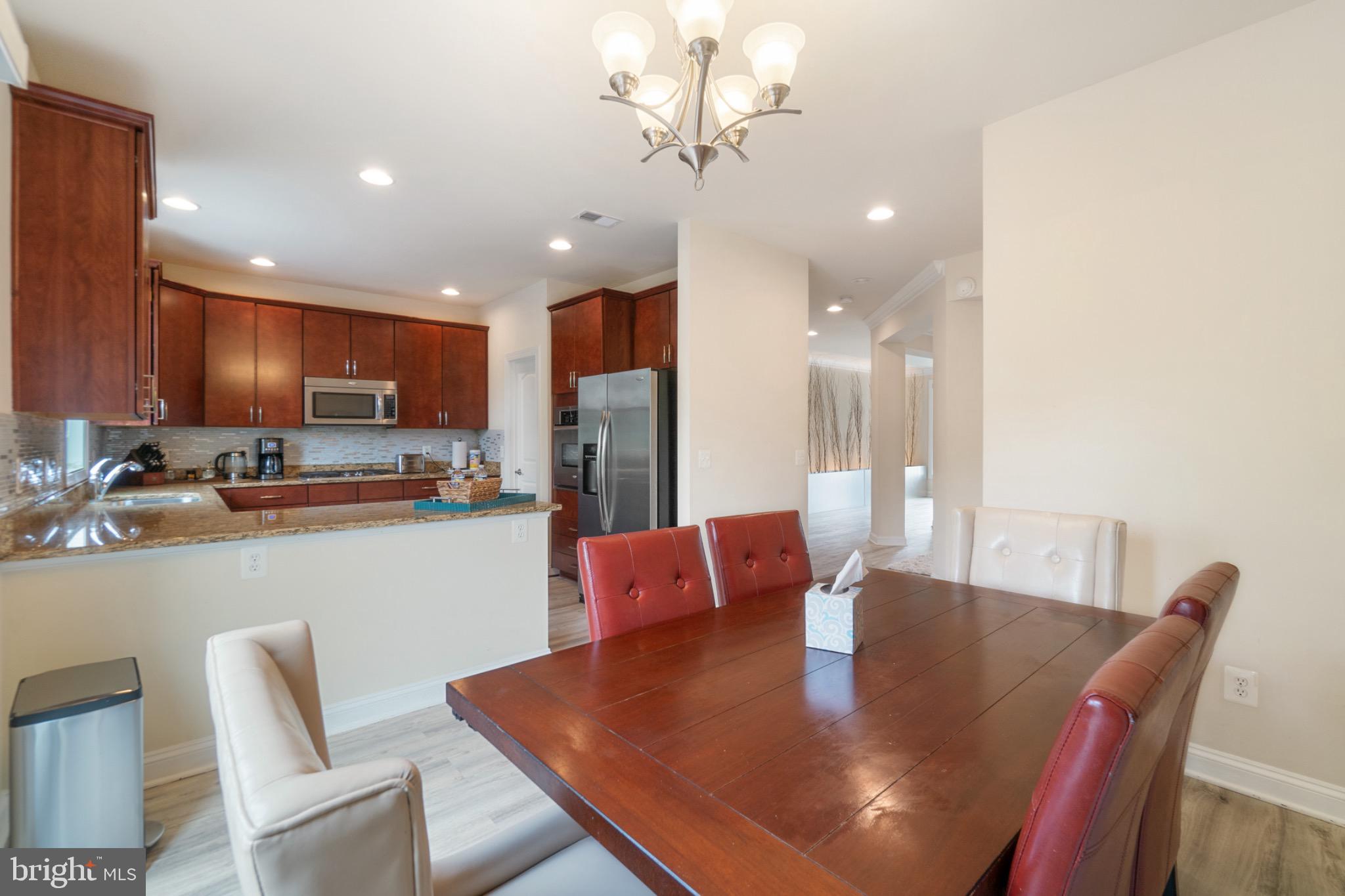 22201 Falling Terrace Ashburn, VA 20148 - Photo 9 of 26 Modern kitchen with inviting dining area.