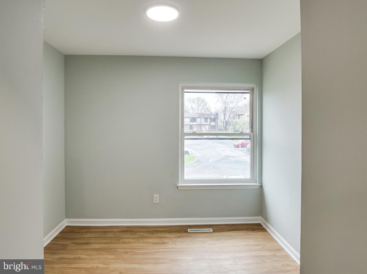 21 Neves Court Baltimore, MD 21234 - Photo 13 of 23 an empty room with windows