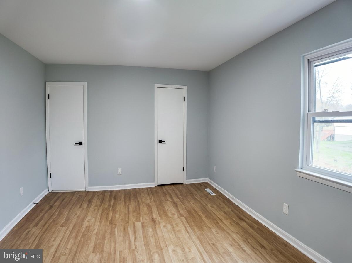 21 Neves Court Baltimore, MD 21234 - Photo 16 of 23 wooden floor in an empty room with a window