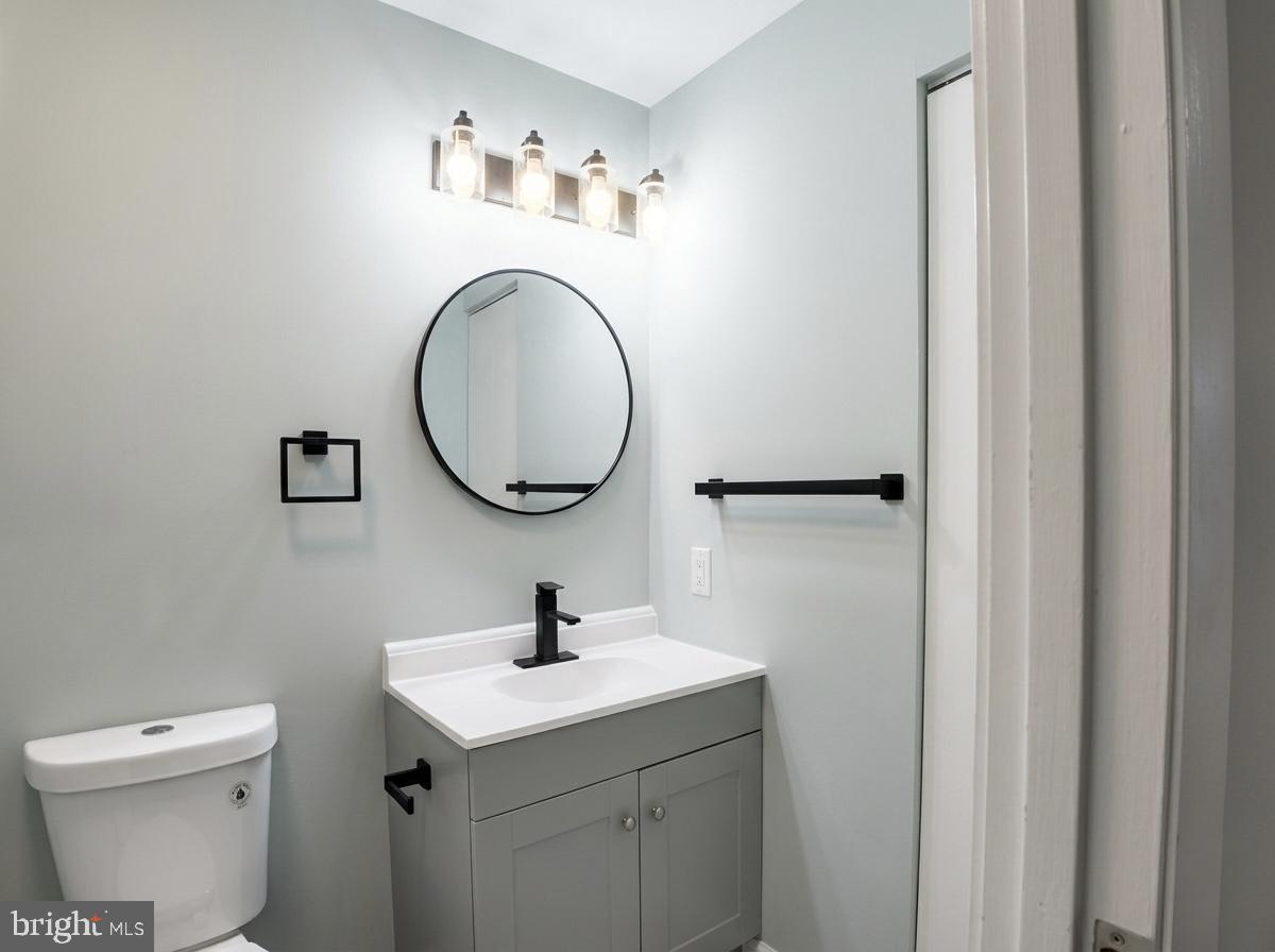 21 Neves Court Baltimore, MD 21234 - Photo 19 of 23 a bathroom with a sink and a mirror