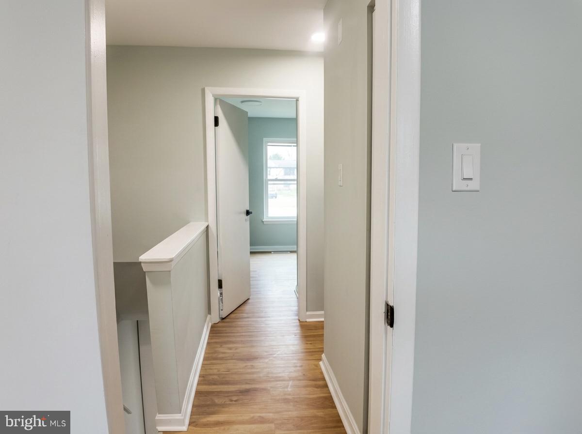 21 Neves Court Baltimore, MD 21234 - Photo 10 of 23 a view of a hallway with wooden floor