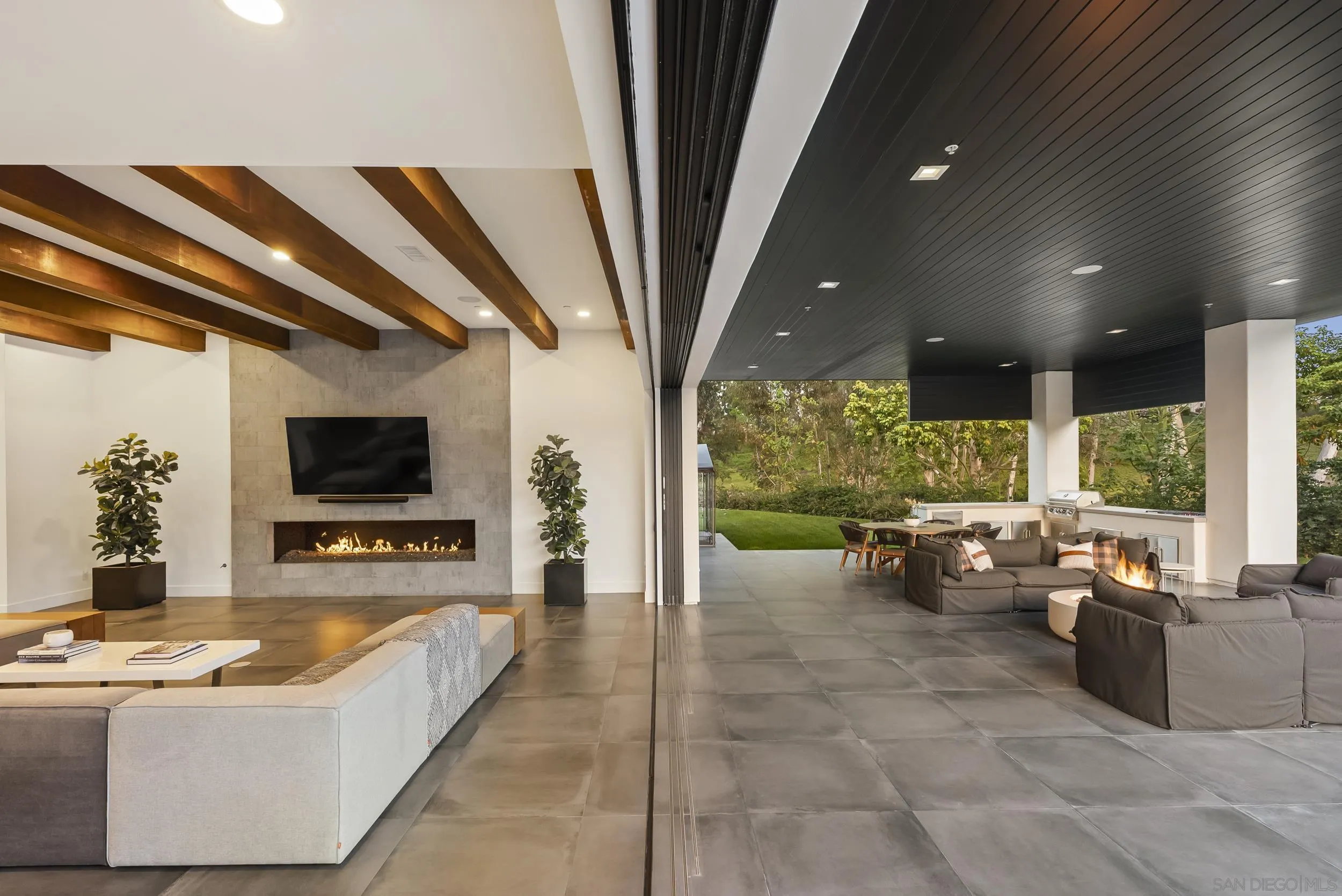 6850 Avenida De La Ronda Rancho Santa Fe, CA 92067 - Photo 4 of 40 a living room with furniture and a flat screen tv
