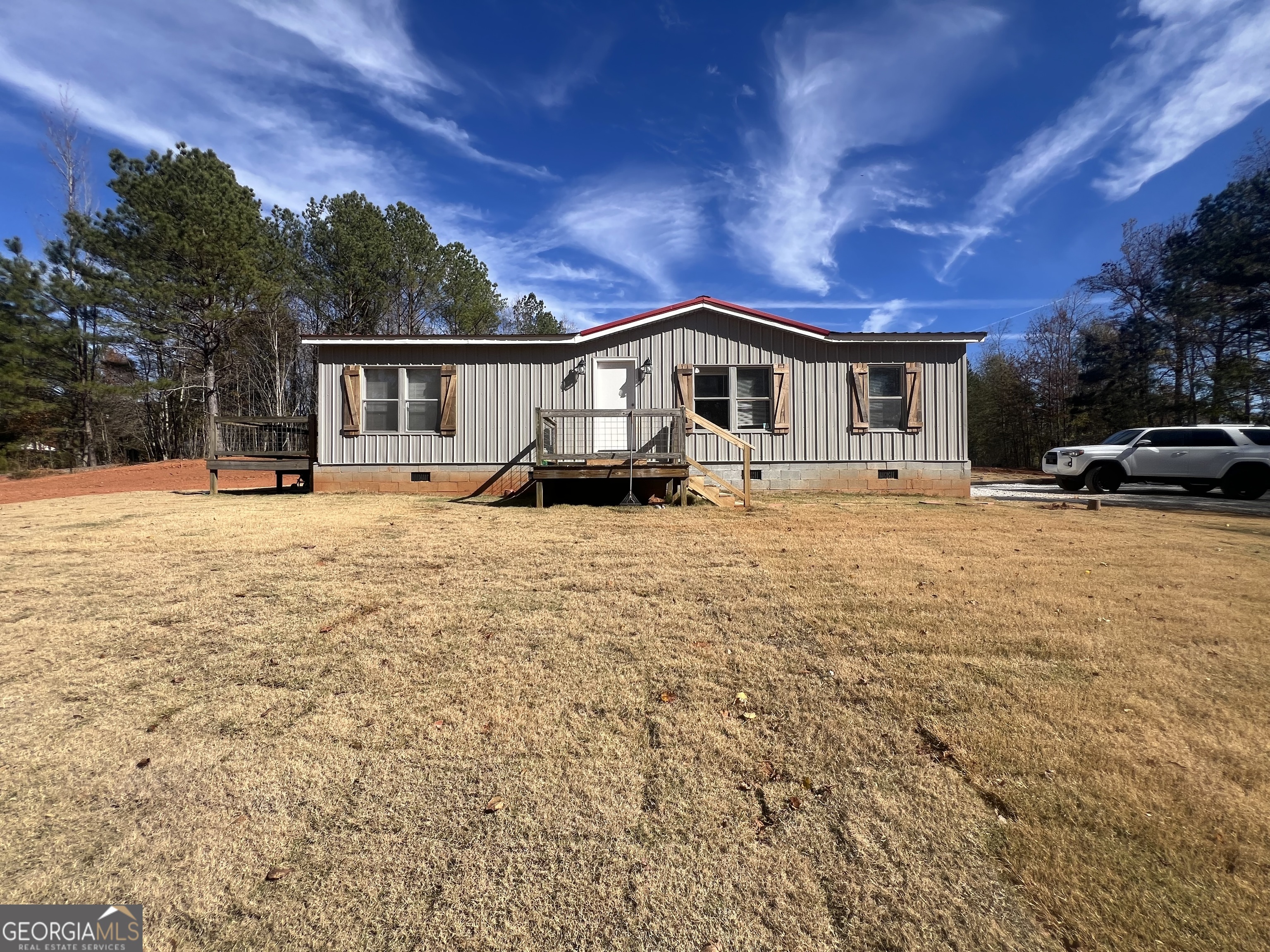 1425 Dowdy Road Roopville, GA 30170 - Photo 1 of 31 a front view of a house with a yard