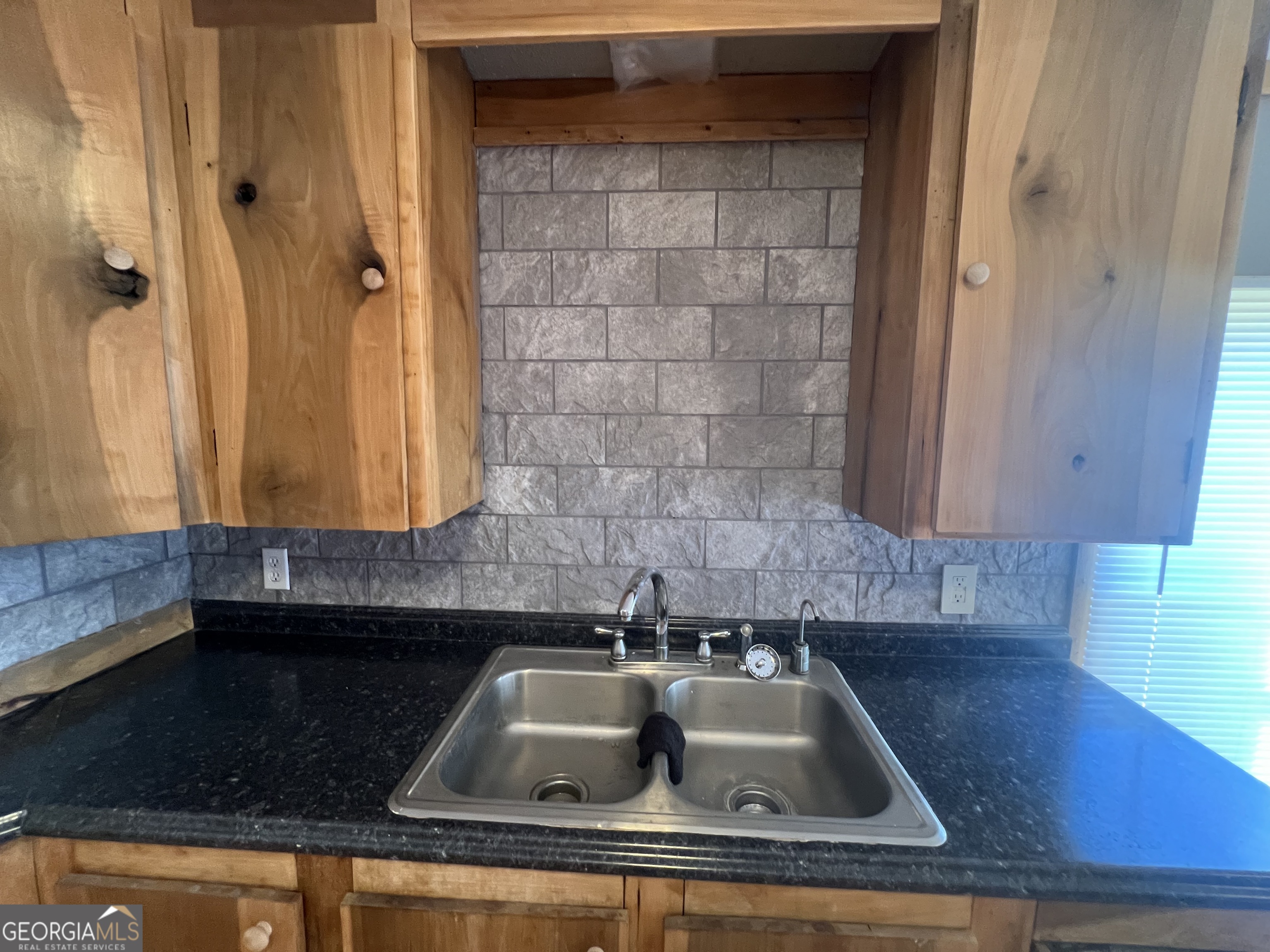 1425 Dowdy Road Roopville, GA 30170 - Photo 11 of 31 a kitchen with a sink and cabinets