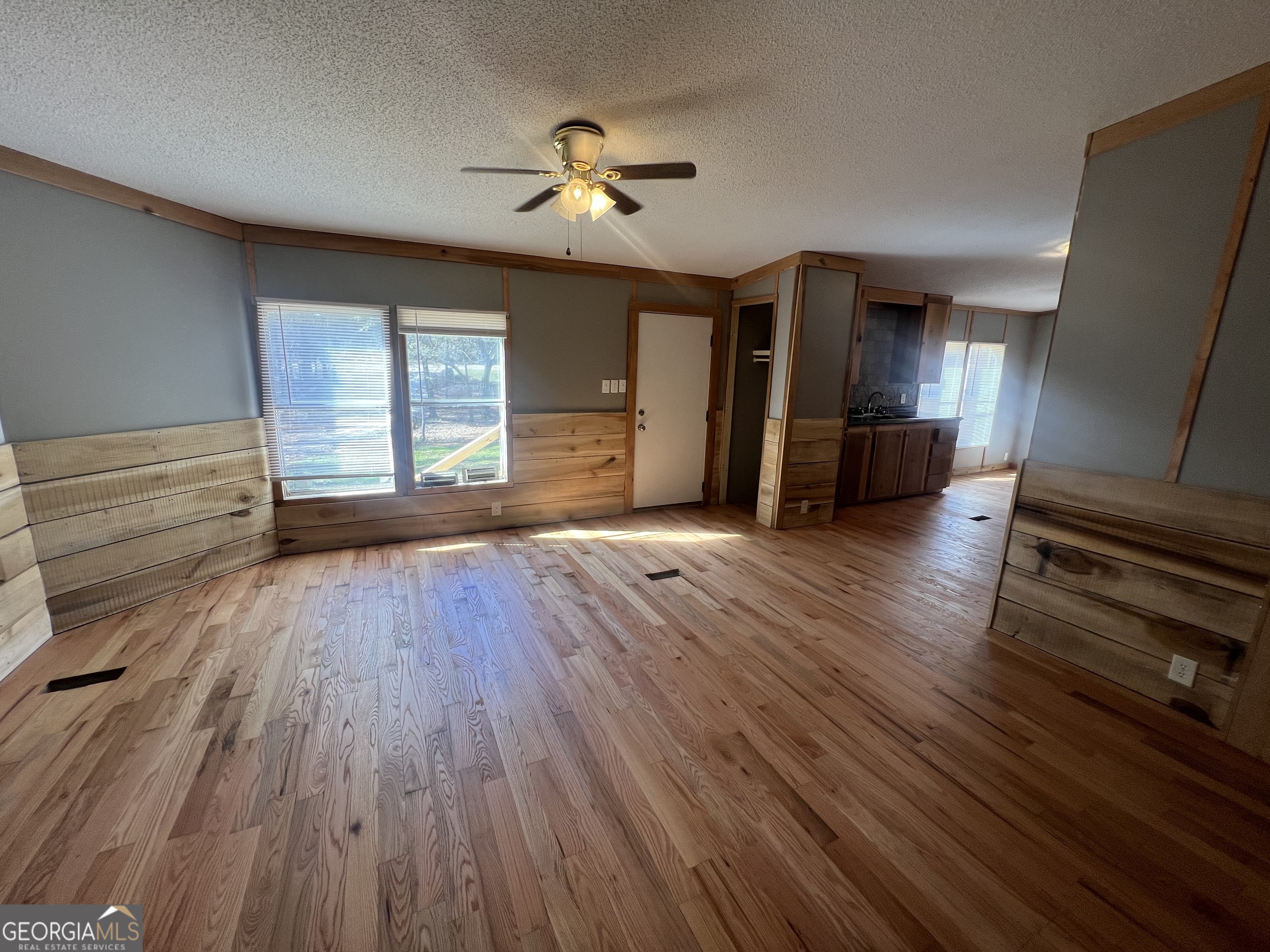 1425 Dowdy Road Roopville, GA 30170 - Photo 5 of 31 a view of a room wooden floor and window