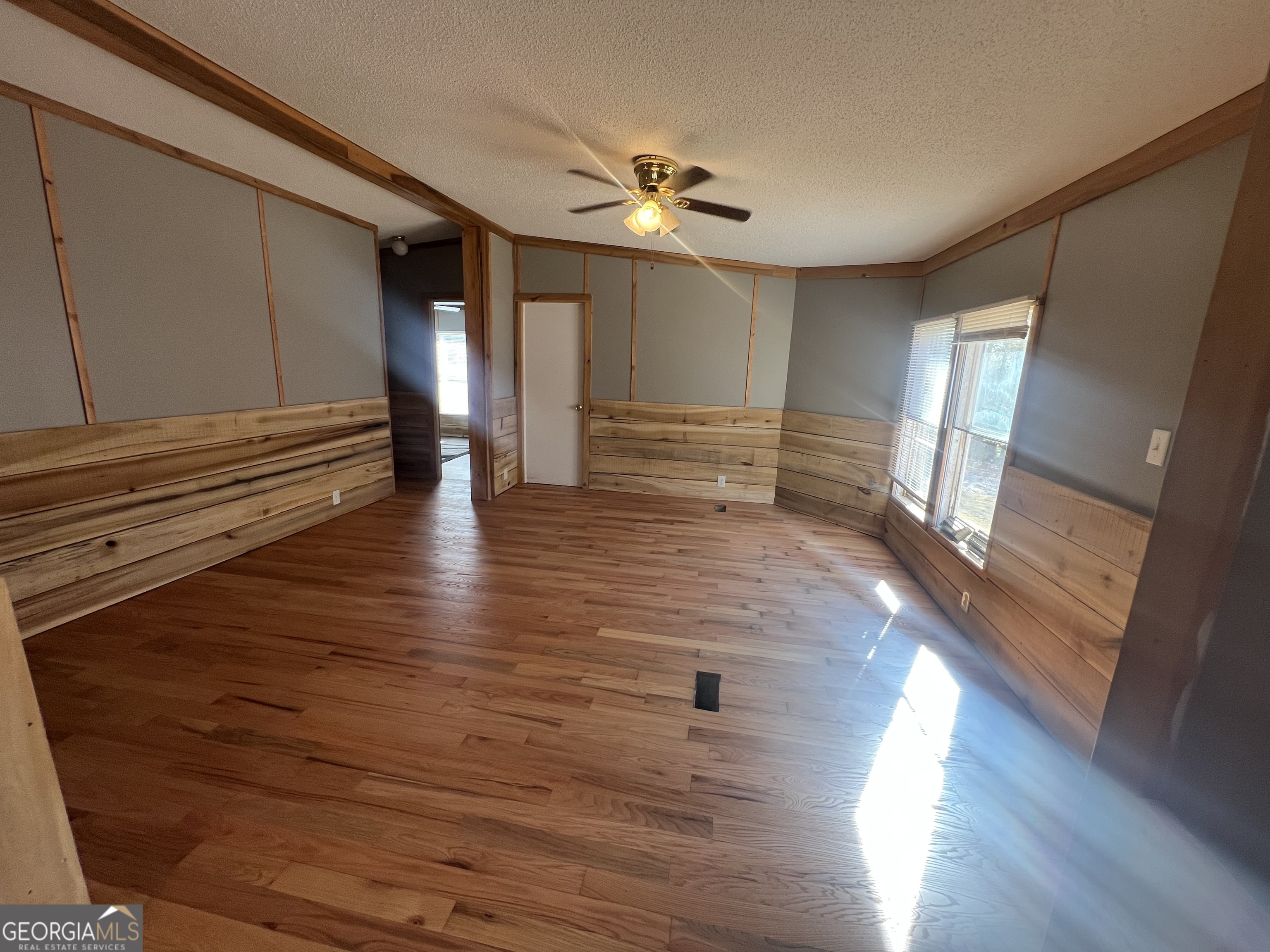 1425 Dowdy Road Roopville, GA 30170 - Photo 7 of 31 a view of empty room with wooden floor
