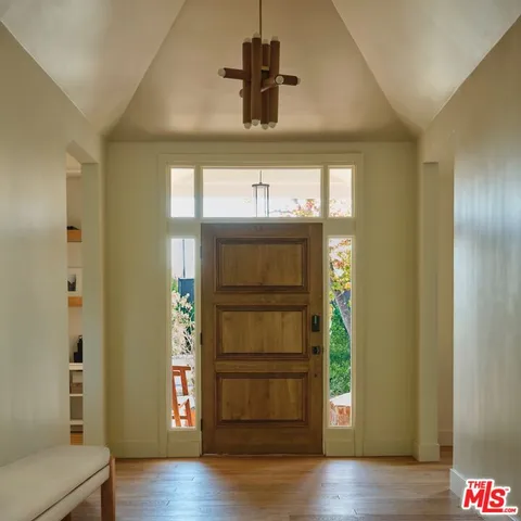 a view of an entryway door and hallway