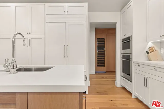 a view of a hallway with white walls