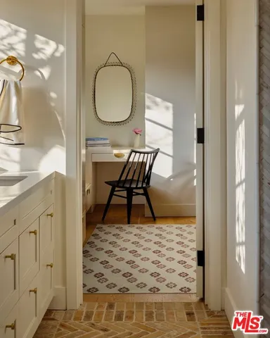 a picture of a bathroom with a sink and a mirror