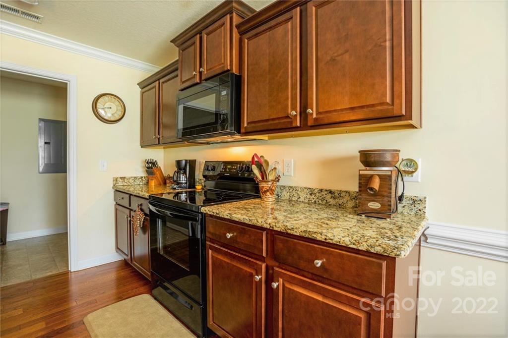 675 Pamela Road York, SC 29745 - Photo 8 of 32 a kitchen with stainless steel appliances granite countertop a sink stove and microwave