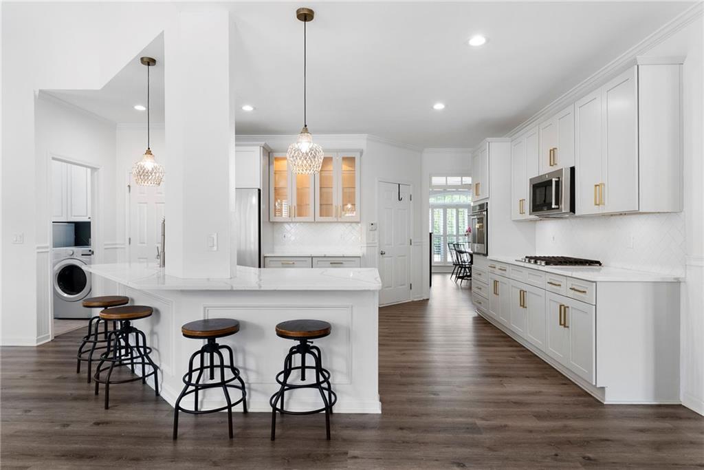 820 Nob Ridge Drive Southwest Marietta, GA 30064 - Photo 12 of 45 a large kitchen with cabinets table and chairs
