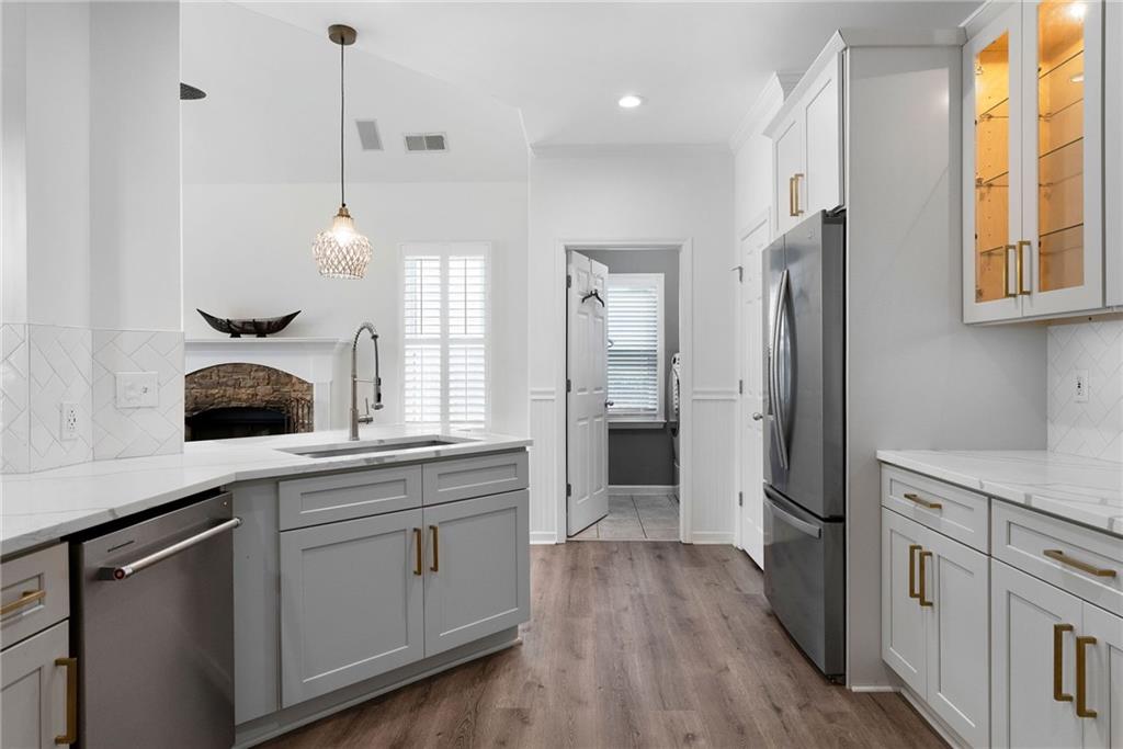 820 Nob Ridge Drive Southwest Marietta, GA 30064 - Photo 16 of 45 a kitchen with white cabinets and sink