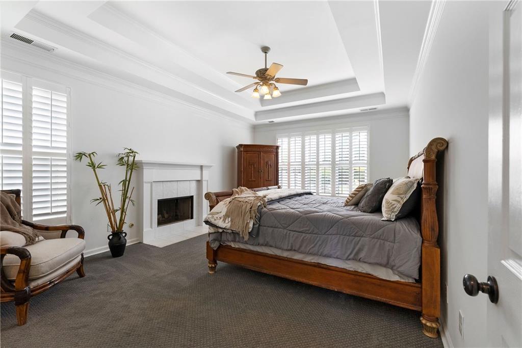 820 Nob Ridge Drive Southwest Marietta, GA 30064 - Photo 24 of 45 a bedroom with a bed couch and a fireplace