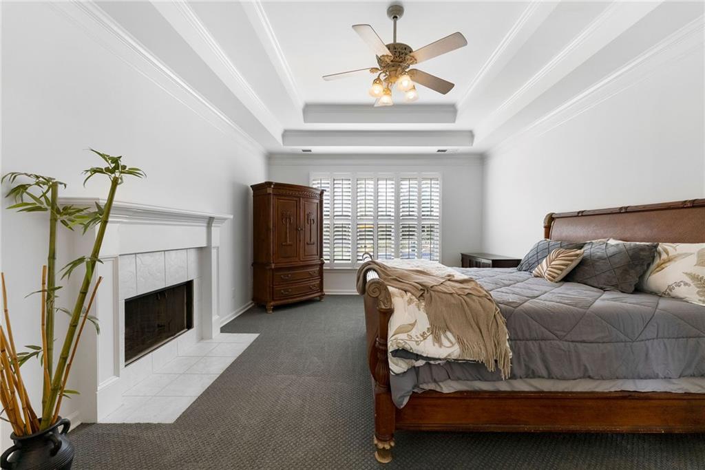 820 Nob Ridge Drive Southwest Marietta, GA 30064 - Photo 25 of 45 a bedroom with a bed and a fireplace