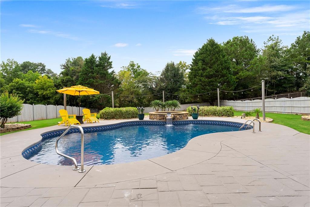 820 Nob Ridge Drive Southwest Marietta, GA 30064 - Photo 34 of 45 a swimming pool with chairs
