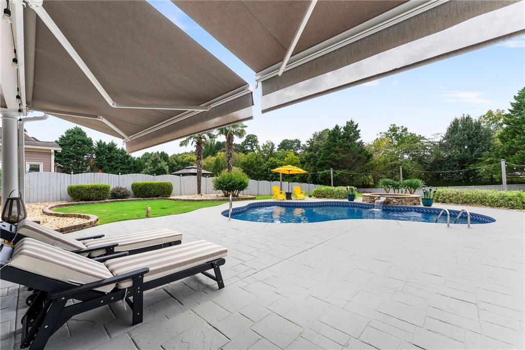 820 Nob Ridge Drive Southwest Marietta, GA 30064 - Photo 36 of 45 a view of a patio with a table and chairs