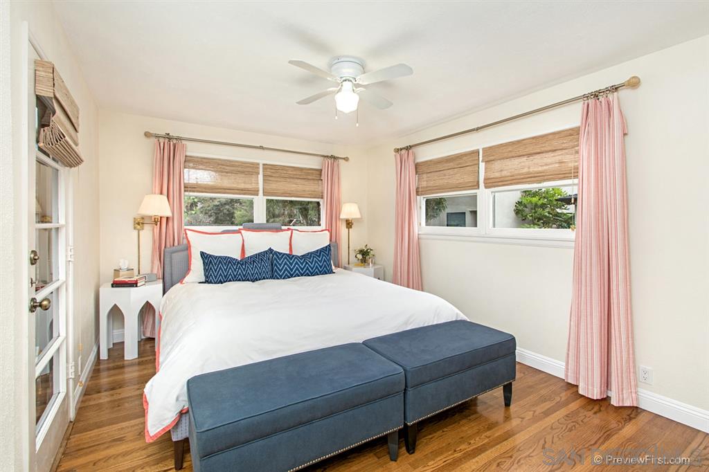 874 Arden Drive Encinitas, CA 92024 - Photo 14 of 25 a bedroom with a large bed and a window