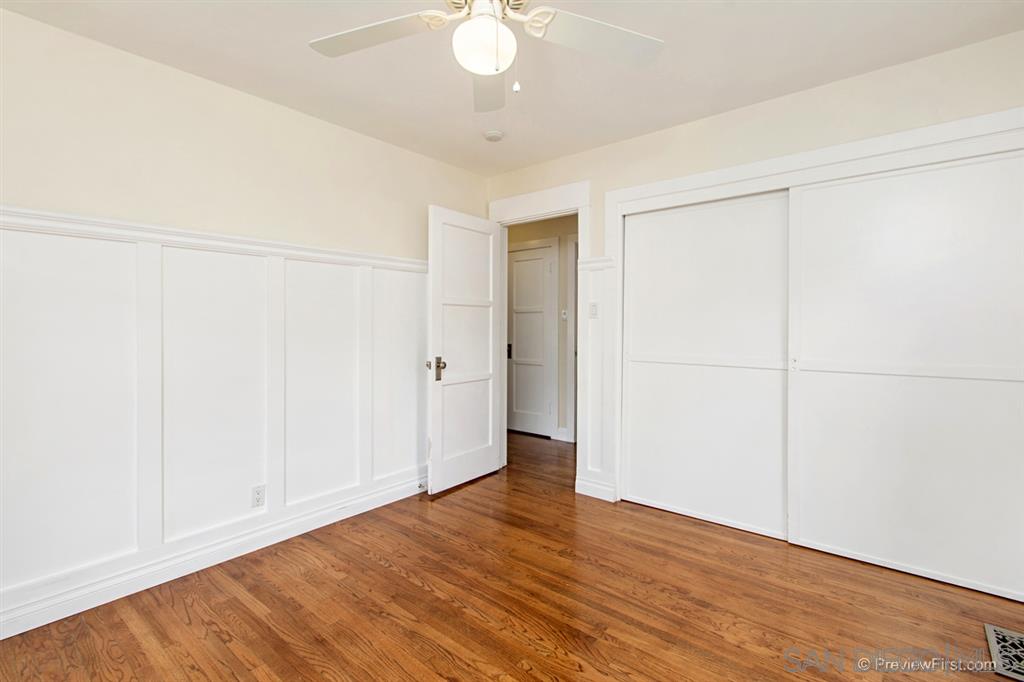 874 Arden Drive Encinitas, CA 92024 - Photo 18 of 25 an empty room with wooden floor and closet